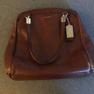 Brown leather coach bag with lots of pockets!